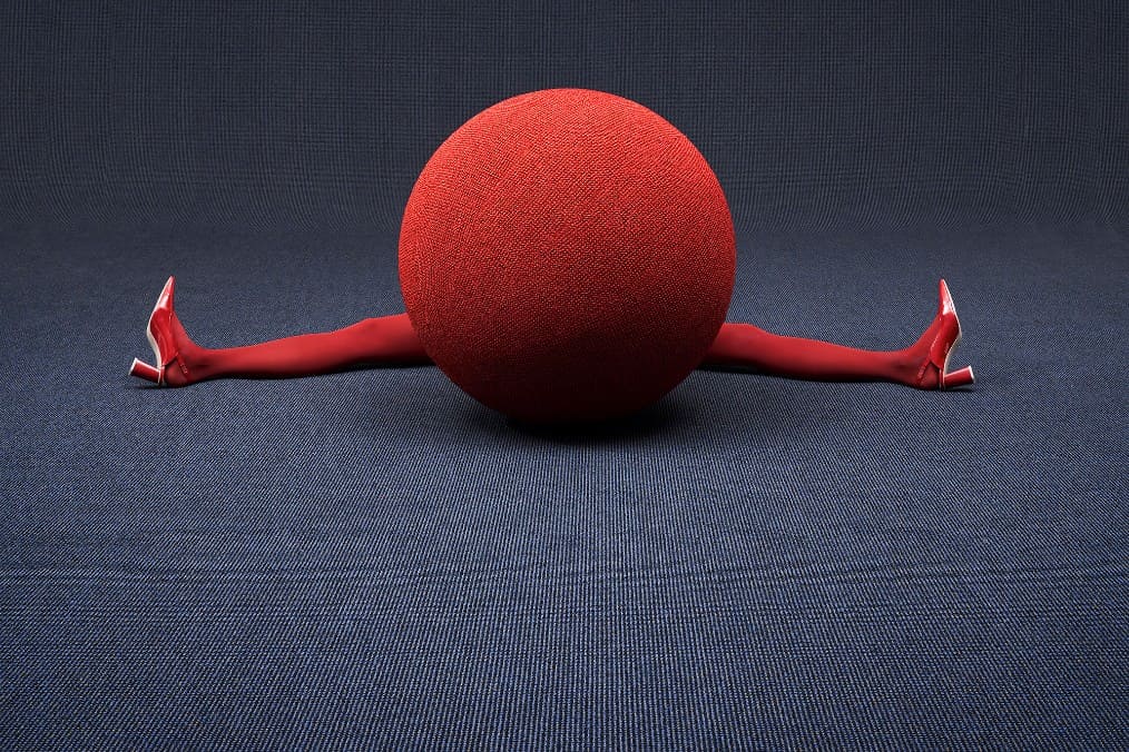 Roter Ball mit zwei Beinen im Spagat